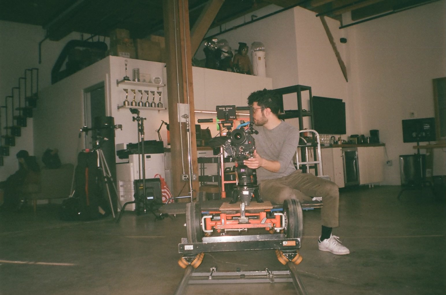 Man filming with camera on a dolly