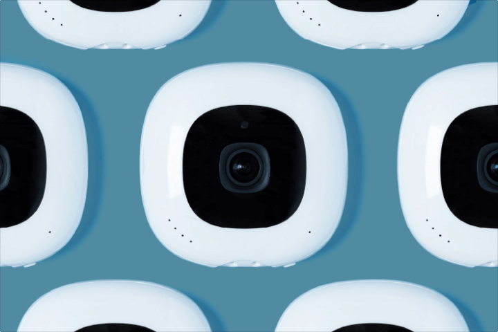 Collage pattern of Nanit cameras on blue background